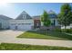 Attractive home with a well-manicured lawn, two-car garage, and appealing architectural accents at 16235 Natures Way, Westfield, IN 46074