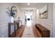 Bright foyer with hardwood floors, stylish furniture, elegant lighting, and decorative accents at 16235 Natures Way, Westfield, IN 46074