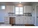 Well-lit kitchen with stainless steel appliances, white cabinets, and decorative backsplash at 16235 Natures Way, Westfield, IN 46074