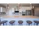 Bright kitchen with white cabinets, stainless steel appliances, large island, and modern lighting at 16235 Natures Way, Westfield, IN 46074