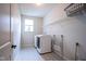 Laundry room with side-by-side washer and dryer hookups, overhead rack, and geometric tile floor at 16235 Natures Way, Westfield, IN 46074
