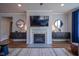 Inviting living room features a cozy fireplace, a mounted TV, and stylish decor at 16235 Natures Way, Westfield, IN 46074