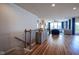 Spacious living room with hardwood floors, fireplace, large windows, and comfortable seating at 16235 Natures Way, Westfield, IN 46074