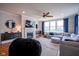 Cozy living room featuring a fireplace, comfortable seating, and a large window for natural light at 16235 Natures Way, Westfield, IN 46074