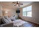 Comfortable living room featuring a large window, hardwood floors, and a ceiling fan at 16235 Natures Way, Westfield, IN 46074