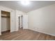 A spacious bedroom with wood-look floors, neutral walls, and closet at 2009 N New York Ave, Muncie, IN 47304