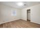 Bedroom featuring a closet, wood-look floors and window for natural lighting at 2009 N New York Ave, Muncie, IN 47304