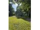 Charming home nestled amidst lush greenery and a spacious front yard at 2009 N New York Ave, Muncie, IN 47304