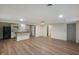 Open kitchen features white cabinetry, an island with wood countertop, and stainless steel appliances at 2009 N New York Ave, Muncie, IN 47304