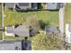 Aerial view of home with a spacious yard, mature trees, and a detached garage at 2026 E 10Th St, Indianapolis, IN 46201