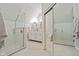 Modern bathroom featuring a glass shower, double vanity, and neutral tiling at 2026 E 10Th St, Indianapolis, IN 46201