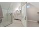 Bright bathroom featuring a glass shower, double vanity, and neutral tiling at 2026 E 10Th St, Indianapolis, IN 46201