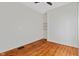 The bedroom showcases hardwood floors, natural light, and a modern ceiling fan at 2026 E 10Th St, Indianapolis, IN 46201