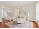 Elegant dining room showcasing a glass table, modern chairs, and an open layout to the kitchen at 2026 E 10Th St, Indianapolis, IN 46201