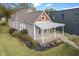 Desirable home with a covered front porch and colorful landscaping, offering an inviting and appealing facade at 2026 E 10Th St, Indianapolis, IN 46201