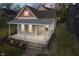 Charming home featuring a covered front porch, meticulous landscaping, and a blend of architectural styles at 2026 E 10Th St, Indianapolis, IN 46201