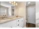Bathroom features a double vanity with granite countertops and white cabinets for ample storage at 216 Haywood Rd, Greenwood, IN 46142
