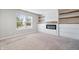 Well-lit bedroom with carpet, a window, a fireplace, and shelving creates a welcoming space at 216 Haywood Rd, Greenwood, IN 46142