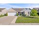 Charming single-story home with brick and siding, a two-car garage, and manicured landscaping at 216 Haywood Rd, Greenwood, IN 46142