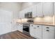 Bright kitchen featuring stainless steel appliances, granite countertops, and ample cabinet space at 216 Haywood Rd, Greenwood, IN 46142