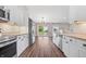 Modern kitchen featuring white cabinetry, granite countertops, stainless steel appliances and luxury vinyl plank flooring at 216 Haywood Rd, Greenwood, IN 46142
