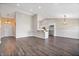 Spacious living room featuring luxury vinyl plank flooring, neutral walls, and ample natural light at 216 Haywood Rd, Greenwood, IN 46142