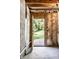 The basement door leading to a green lawn and mature trees at 2247 Frisco Pl, Indianapolis, IN 46240