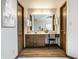 Ensuite bathroom with wood cabinets, vanity area, and a doorway leading to the bedroom at 2247 Frisco Pl, Indianapolis, IN 46240