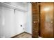Bright closet space with wooden door, a shelf, and hardwood flooring at 2247 Frisco Pl, Indianapolis, IN 46240