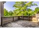 A rustic wooden deck with wooden railings overlooking a lush green landscape at 2247 Frisco Pl, Indianapolis, IN 46240