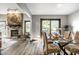 Open dining room with a fireplace, wicker chairs, and sliding doors leading to a delightful backyard at 2247 Frisco Pl, Indianapolis, IN 46240