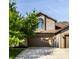 Charming two-story home with a well-manicured lawn and an attached two-car garage at 2247 Frisco Pl, Indianapolis, IN 46240