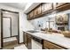 Well-maintained kitchen offers a peek into living area with fireplace, creating a warm, inviting atmosphere at 2247 Frisco Pl, Indianapolis, IN 46240