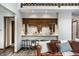 Cozy eat-in kitchen with bar stool seating, opening to a modern living space at 2247 Frisco Pl, Indianapolis, IN 46240