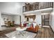 Spacious living room with a loft, adjoining dining area, and modern furnishings at 2247 Frisco Pl, Indianapolis, IN 46240