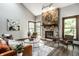 Inviting living room with a stone fireplace, wood floors, and stylish decor at 2247 Frisco Pl, Indianapolis, IN 46240