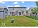 Spacious backyard featuring a well-maintained lawn and charming bird bath at 2309 Westmere Dr, Plainfield, IN 46168