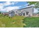 Expansive backyard with lush green lawn, shed, patio, and inviting outdoor seating area at 2309 Westmere Dr, Plainfield, IN 46168