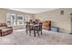 Combination dining/living area with neutral walls, carpeting and natural light at 2309 Westmere Dr, Plainfield, IN 46168