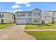 Charming two-story home with a well-manicured lawn and attached two car garage at 2309 Westmere Dr, Plainfield, IN 46168