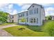 Beautiful two-story home with a green lawn and mature tree in the front yard at 2309 Westmere Dr, Plainfield, IN 46168