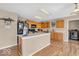 Well-lit kitchen features wooden cabinets, modern appliances, and an island with light countertops at 2309 Westmere Dr, Plainfield, IN 46168
