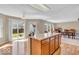Spacious kitchen with an island and views of the backyard through sliding glass doors at 2309 Westmere Dr, Plainfield, IN 46168
