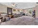 Comfortable living area with ceiling fan, neutral walls, carpeting and a cozy feel at 2309 Westmere Dr, Plainfield, IN 46168