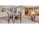 Inviting living room features neutral tones, a dining area, and seamless flow into the kitchen at 2309 Westmere Dr, Plainfield, IN 46168
