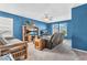 Spacious living room with bright blue walls and modern ceiling fan at 2309 Westmere Dr, Plainfield, IN 46168