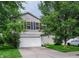 Charming two-story home with vinyl siding, attached garage, and well-maintained front lawn at 2355 Collins Way, Greenfield, IN 46140