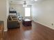 Bright room with hardwood floors, a ceiling fan, and a large window at 2355 Collins Way, Greenfield, IN 46140
