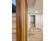 Basement staircase with wooden accents, wooden stairs, and wood-style flooring at 2543 Union St, Indianapolis, IN 46225