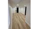 Finished basement with wooden flooring, bright lighting and a sliding closet door at 2543 Union St, Indianapolis, IN 46225